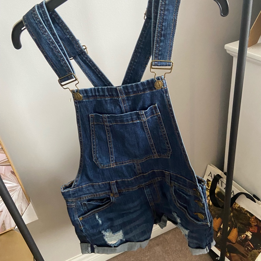 Overalls in a dark jean